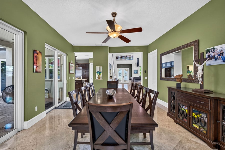 10 seat dining room opens to pool deck and aviary