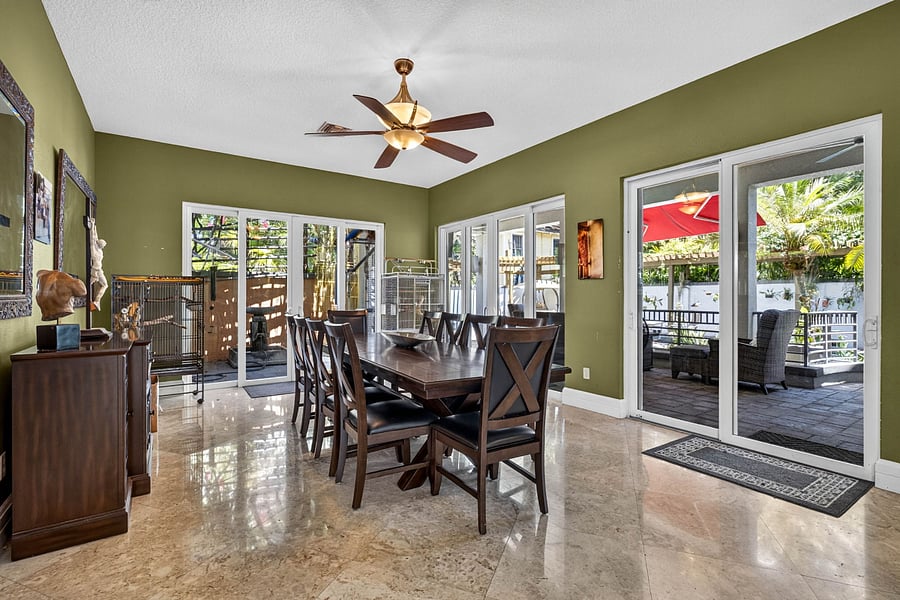 dining room w. 10 seats, view of aviary and view of pool deck