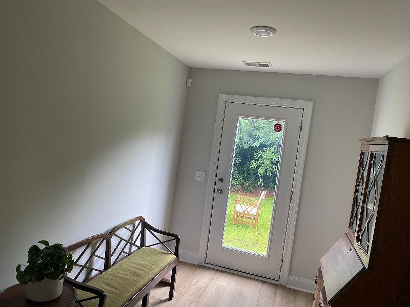seating area outside bedroom, rear entrance to outdoor living space. this can be a flex space if you have a desk or something else you'd like to bring, i can move things around.