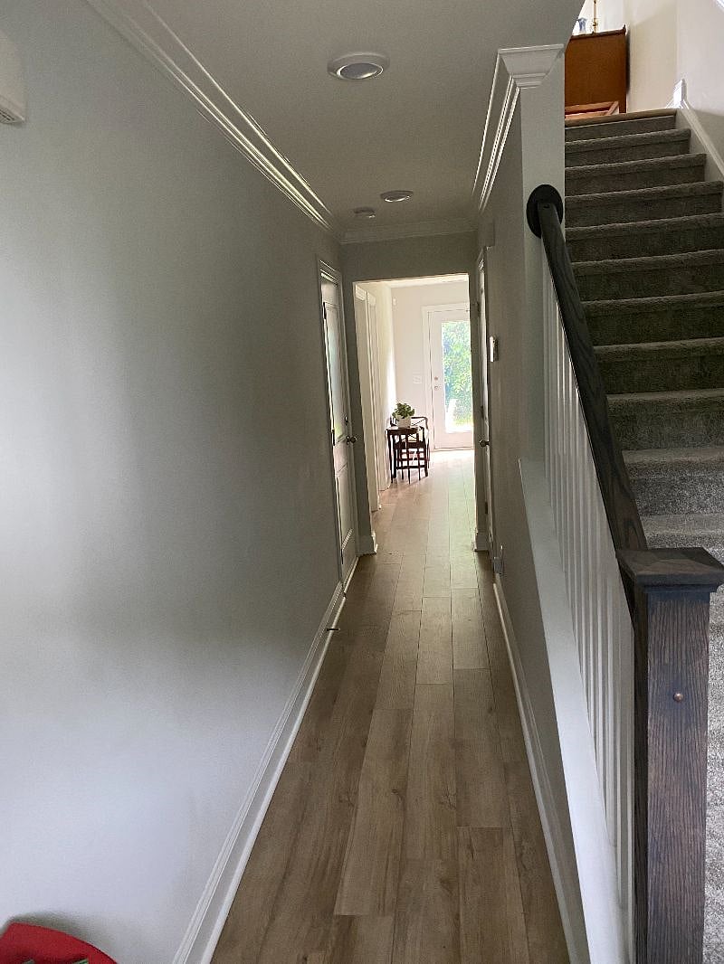view from front door. shared entry spaces and coat closets
