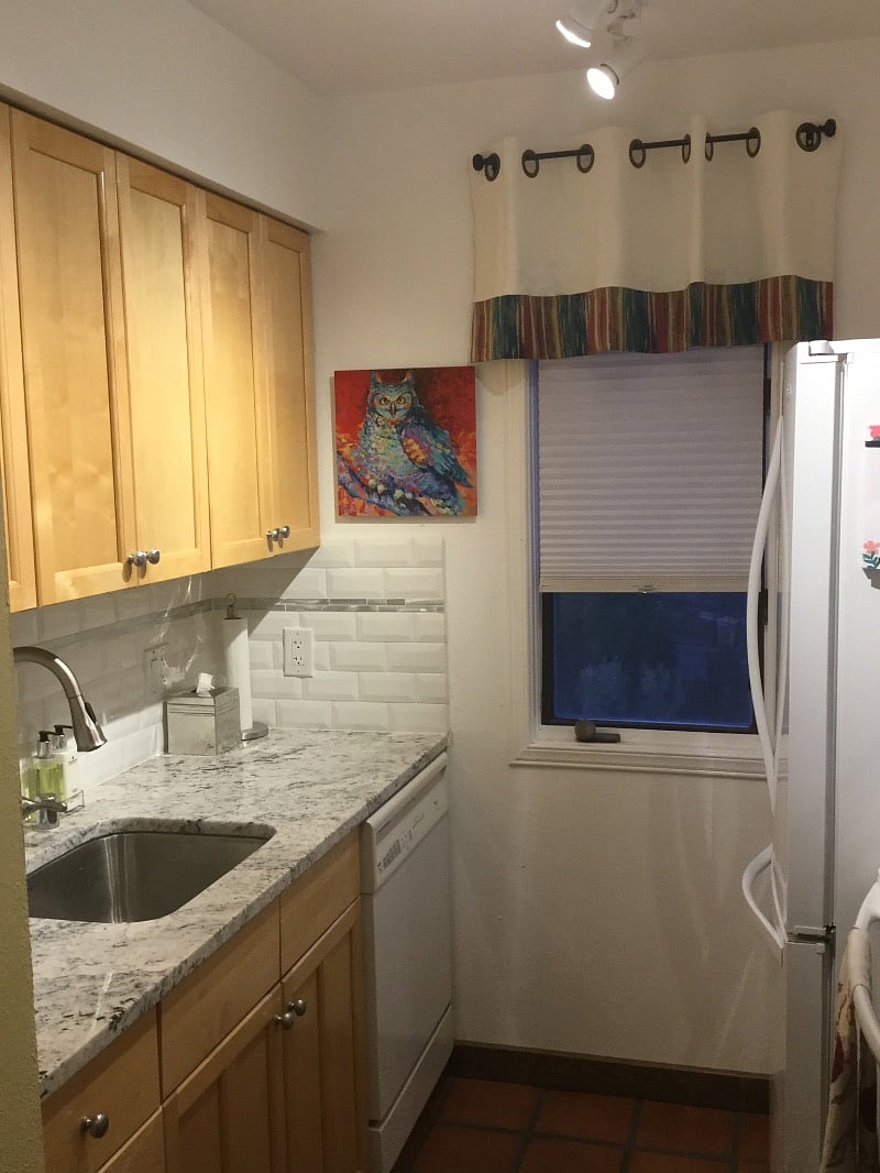 Galley kitchen: granite countertops, full-size Frig, stove, microwave, dishwasher.
