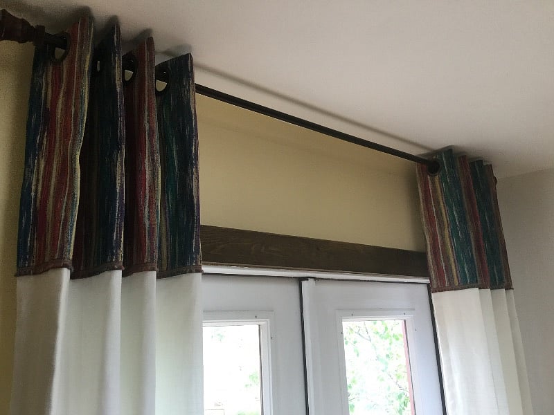 Glass French doors trimmed with designer drapes