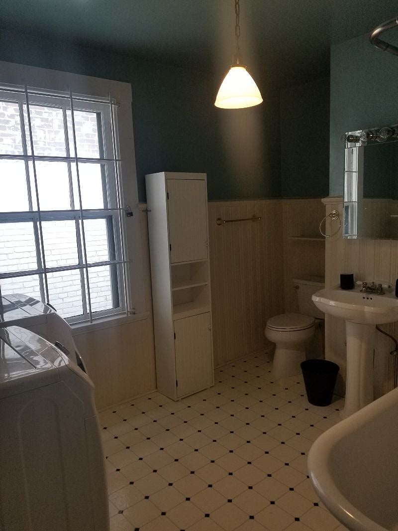 Large bathroom with Washer/dryer and clawfoot tub / Shower combo