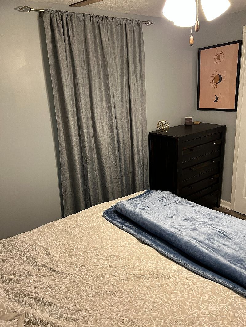 Black out curtains for light control. Large 4-drawer dresser.