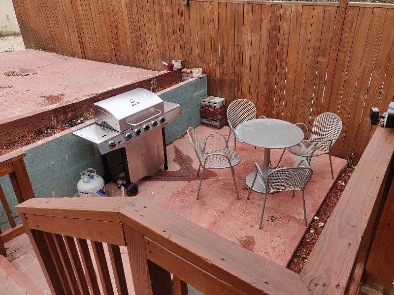 parking pad to the left for two cars, grill and outdoor furniture included