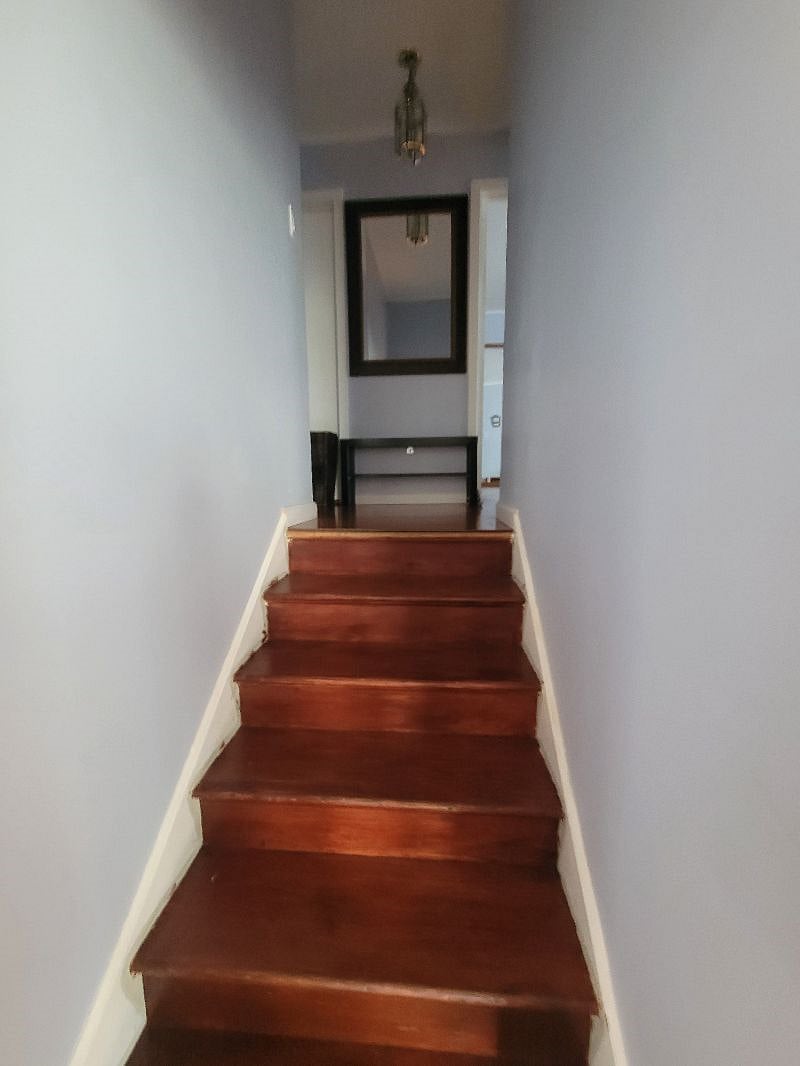 Up the stairs into the west wing of the house