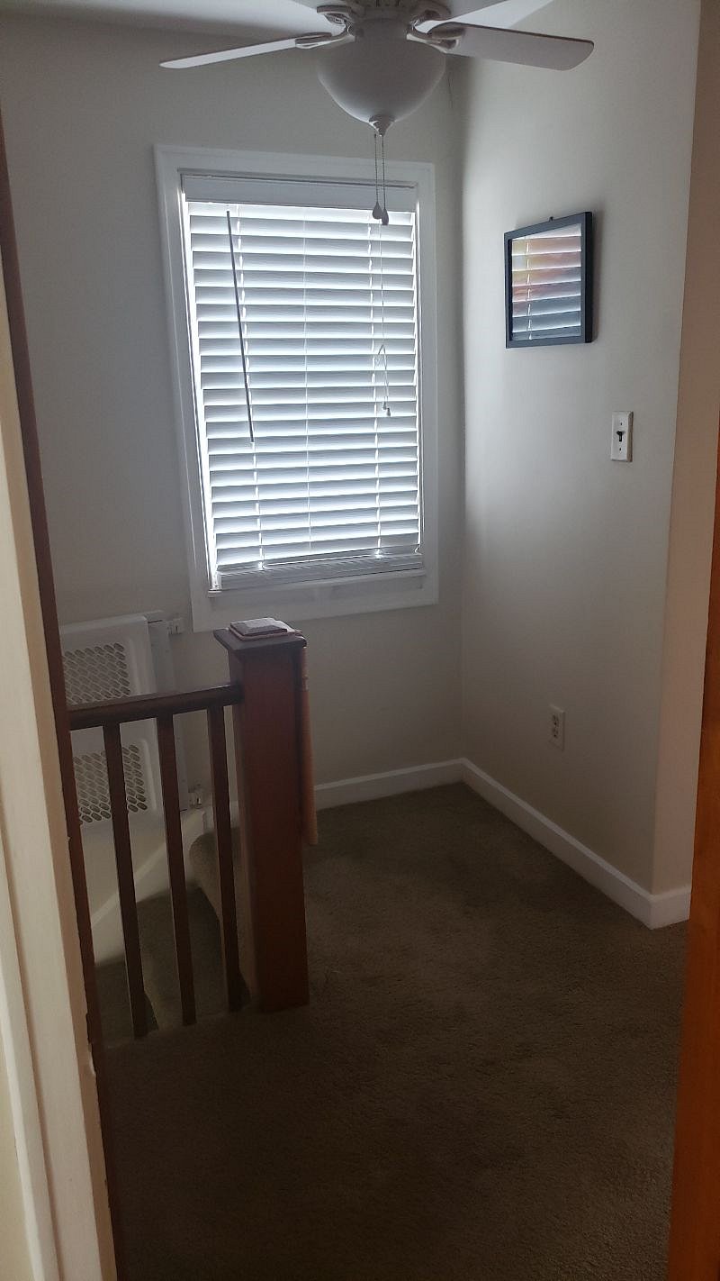 Foyer connecting both bedrooms and the main bathroom.