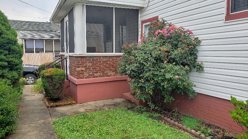 Back yard with screened in porch.