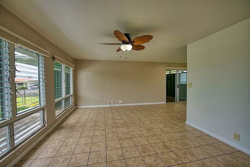 The view from the front door looking into the living room, kitchen is on the other side of the wall on the right.