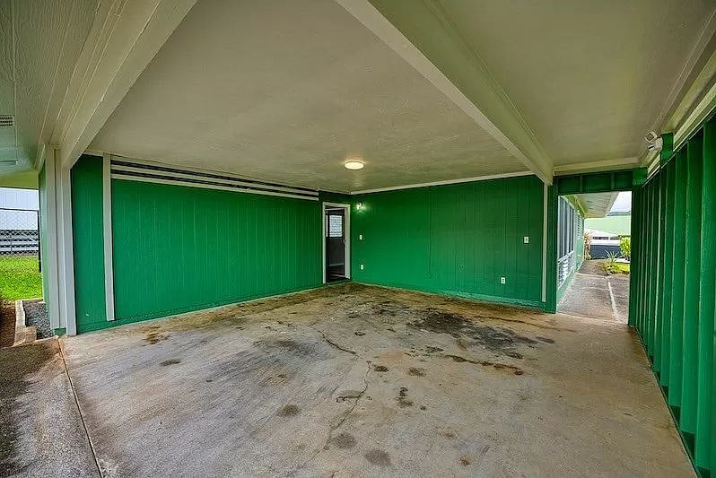 Covered carport fits two cars.
