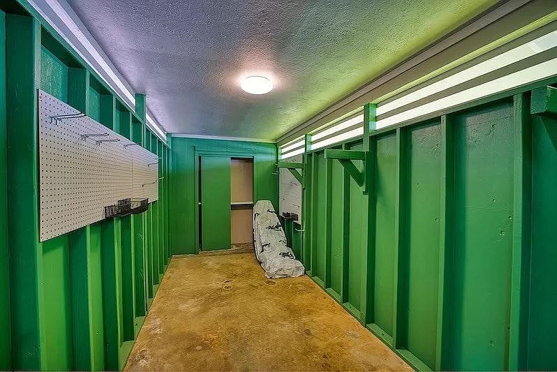 Covered storage next to carport.