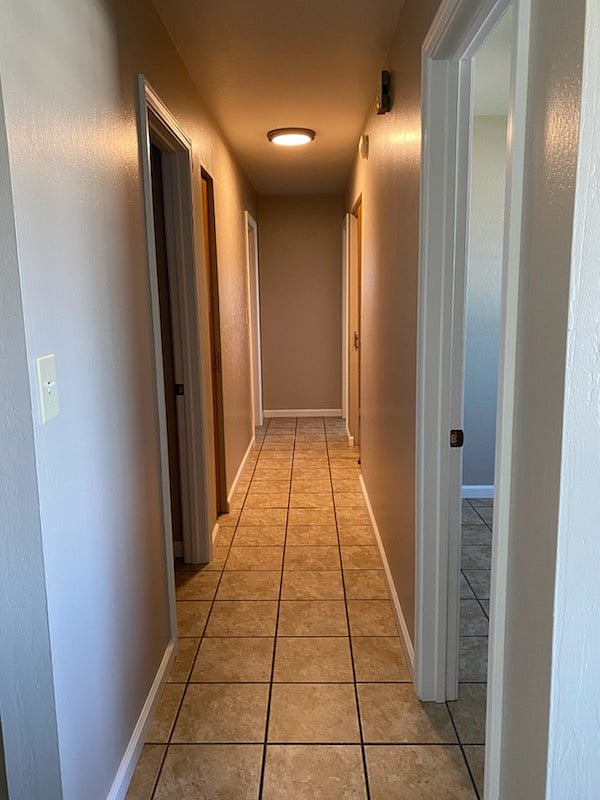 Looking down the hallway from the living room/front door entrance.