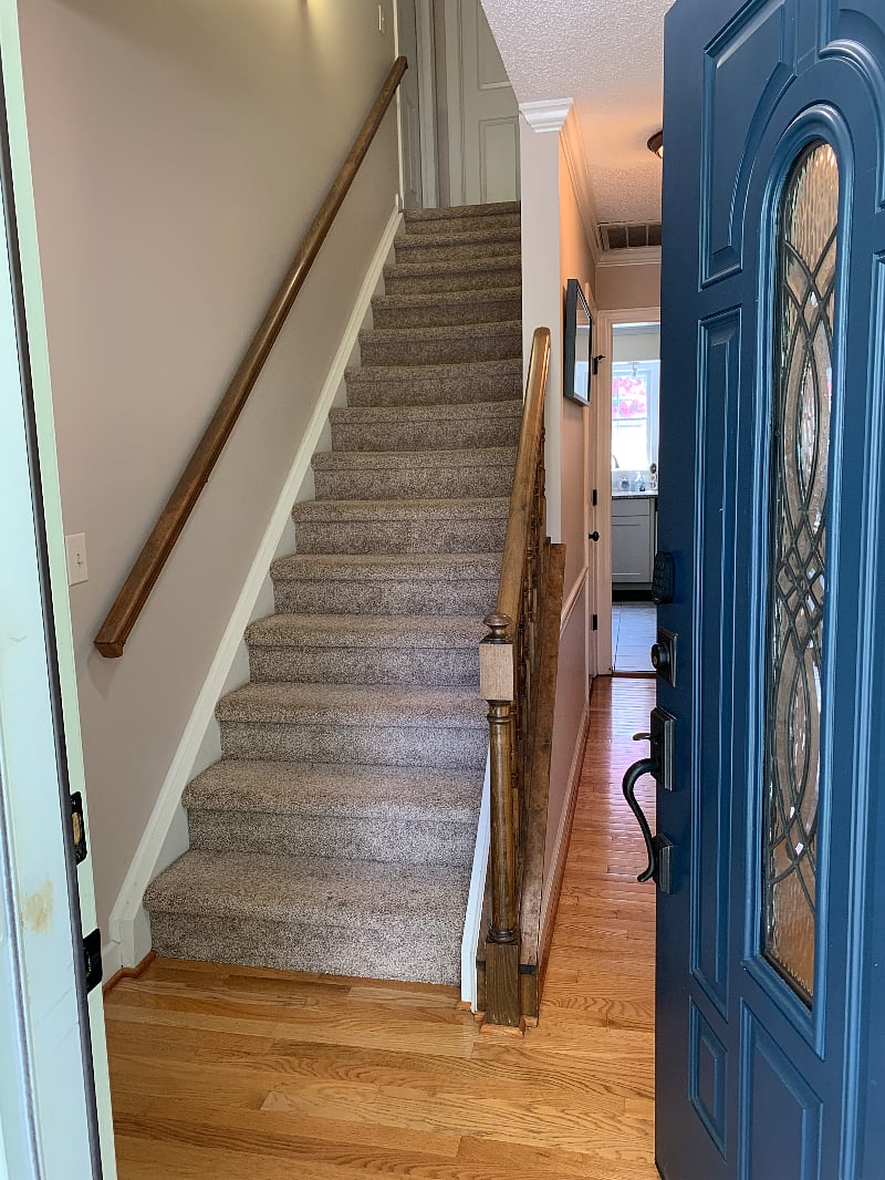 Stairway at front of house to upstairs private bedroom and bathroom