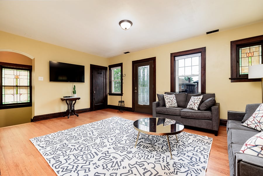 From the left: Entrance Archway from front door, Smart TV, Large walk in closet, door to private 2nd floor front sundeck, stained glass windows