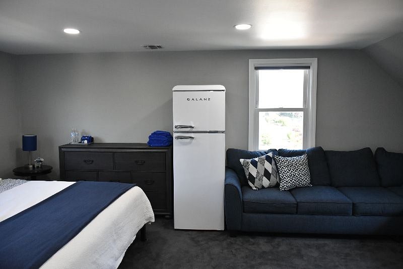 This king bedroom comes with its own refrigerator and lounge area for your privacy.  $2100  Prices reduced with the addition of added tenants to the other private rooms.