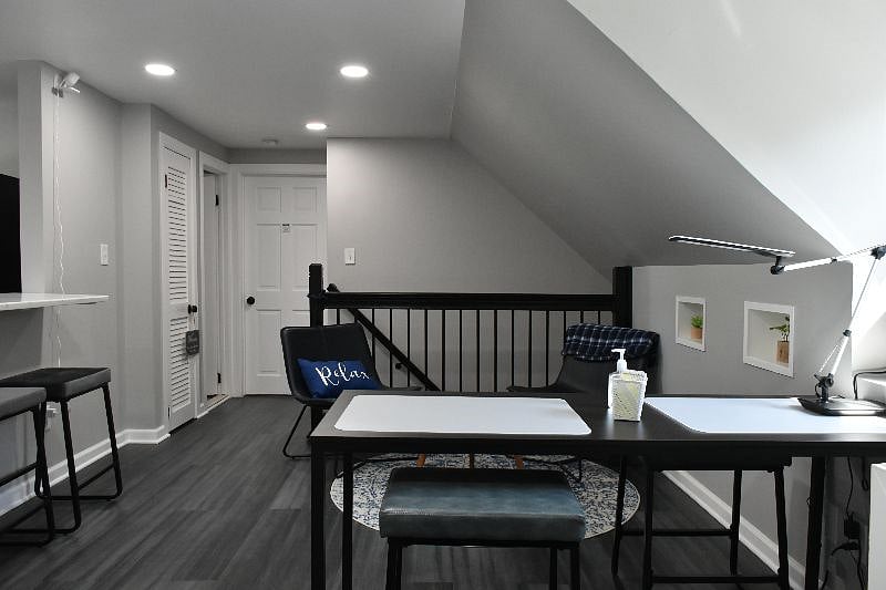 This is the shared living room space with work table for laptops, etc..