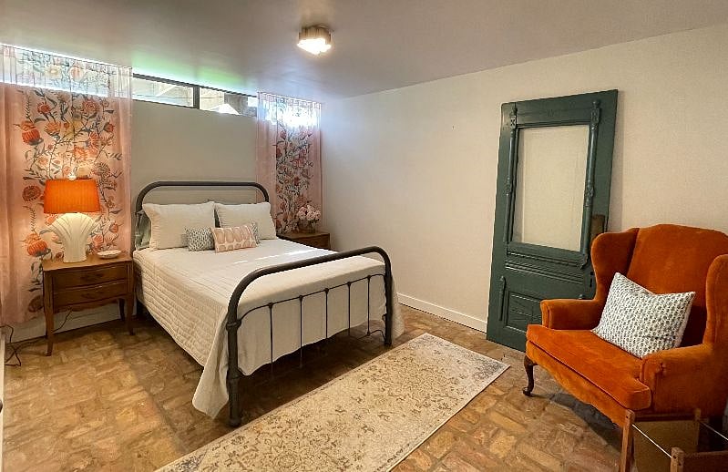 This is the bedroom is available in the listed monthly fee. Comfortable bed and a nice sized closet off camera to the left.