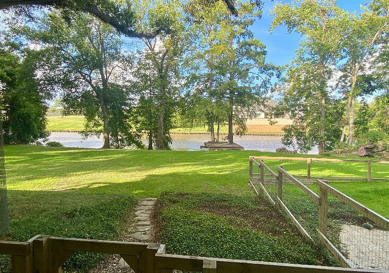 Enjoy this front porch view or sit on the dock rocking chair and let the river relax you!
