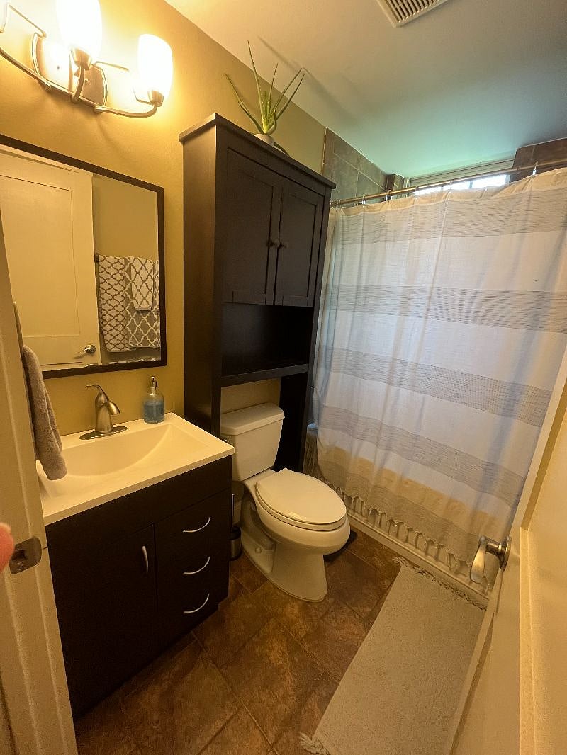 Clean and functional bathroom with extra storage.