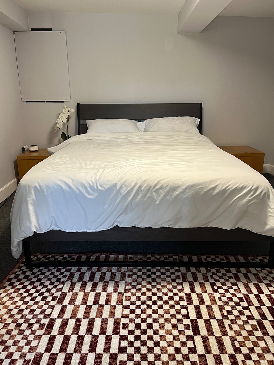 Bedroom with Queen Size Bed, Sound Machine, and Air Purifier