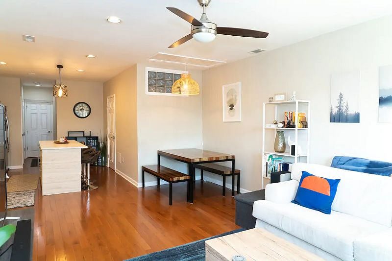Designated dining/sitting area located in between Kitchen and Living room, large wood table with picnic style benches. Perfect for the many games in the condo.
