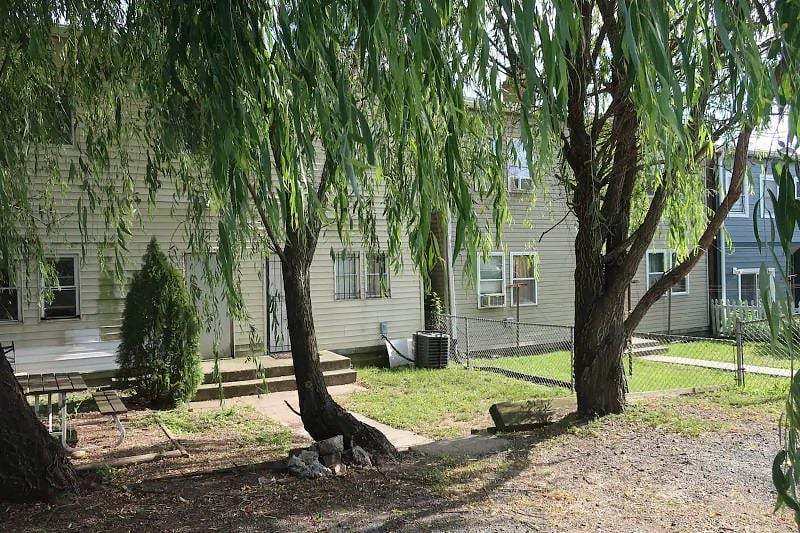 Designated Private Parking Spot in the back. The back area is now enclosed by a fence. 