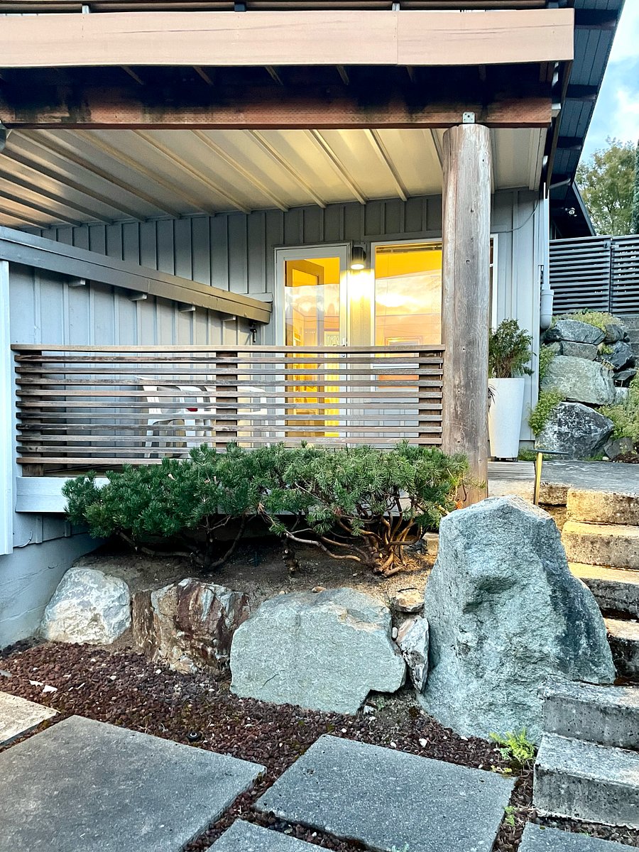 Twilight from patio below, up to covered porch- window into main seating area. Exclusive-use outdoor area!