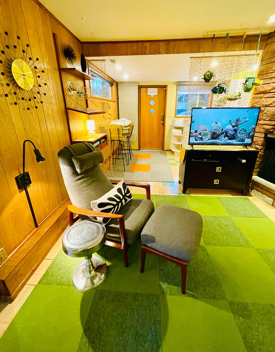 View of front door to kitchen/dining from seating area.