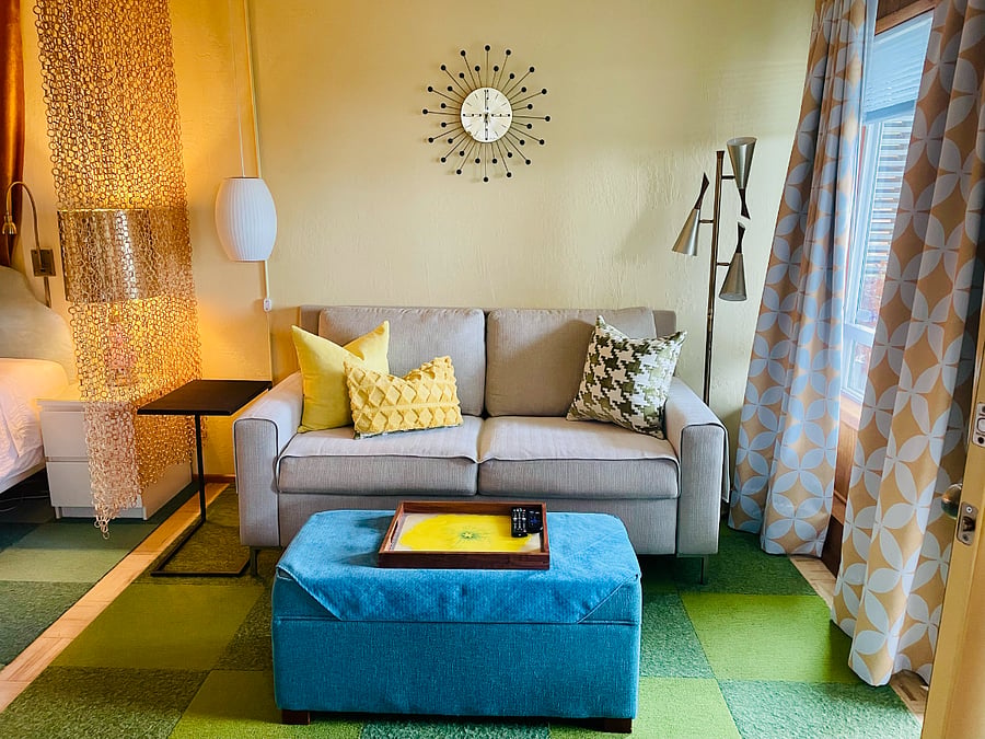 No springs, Crate & Barrel sleeper sofa double-size 4" memory foam platform. Contract grade. C&B forged iron C-table for laptop/snacks. Triple cone floor lamp, ca. 1960's.