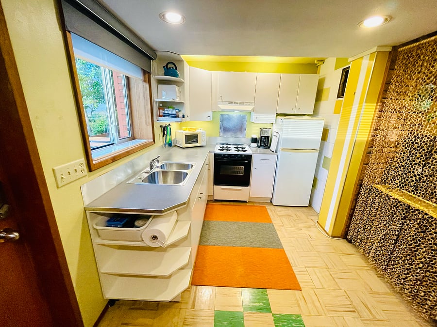 Well-lit kitchen includes under-cabinet lighting.