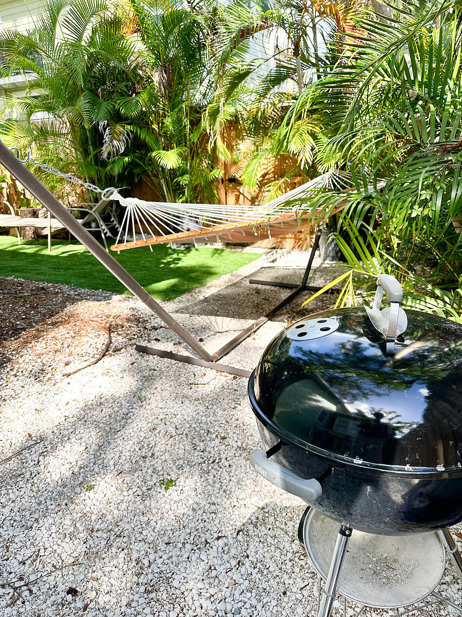 Hammock, outdoor dinning and charcoal grill provided.