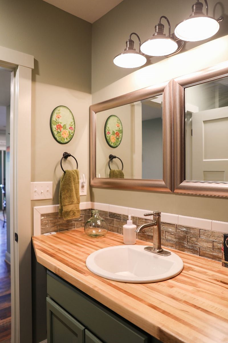 Hairdryer, noise reduction machine, first aid kit, organic liquid soap, and shampoo and conditioner in the bathroom.