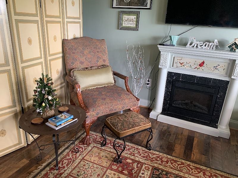 Put your feet up and Relax next to the eletric fireplace.