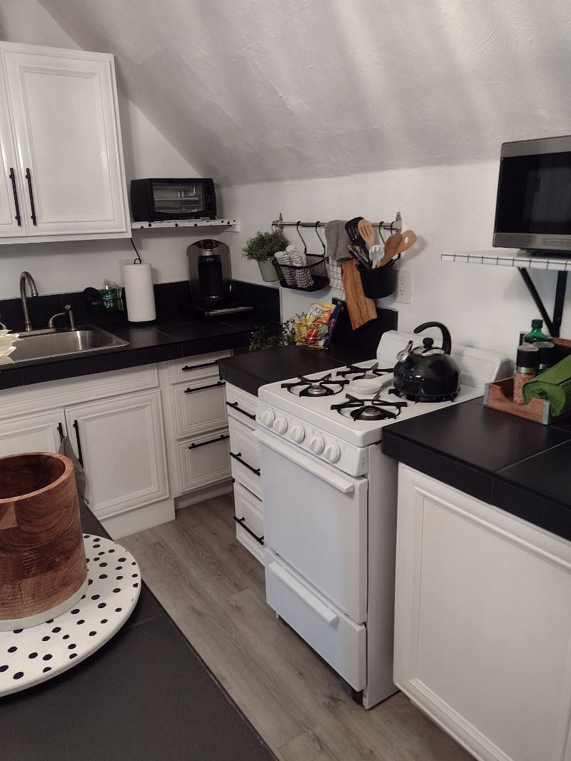 Well stocked kitchen with gas stove