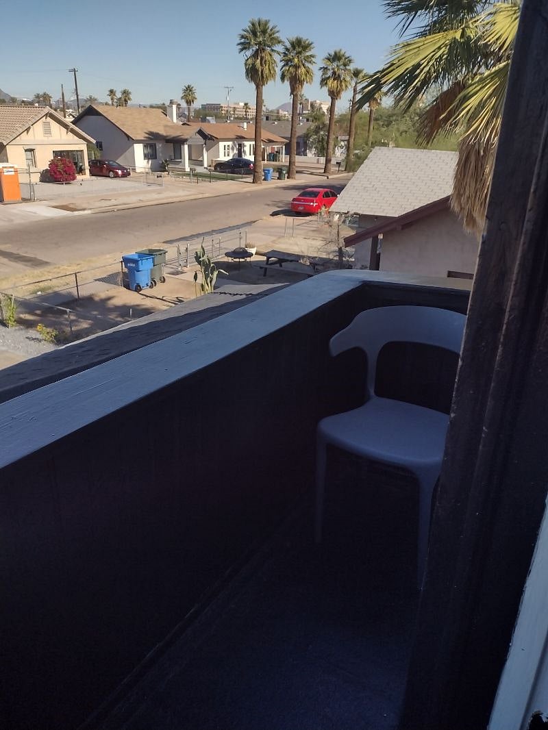balcony with 2 chairs off bedroom