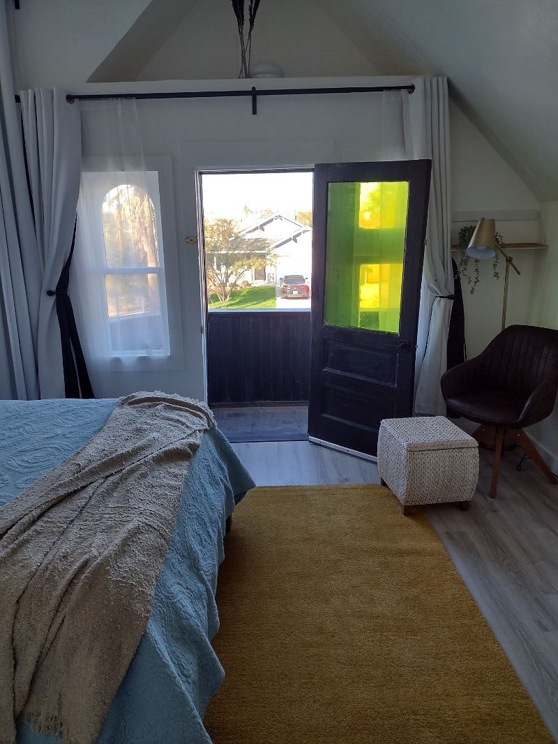 Balcony door open in bedroom