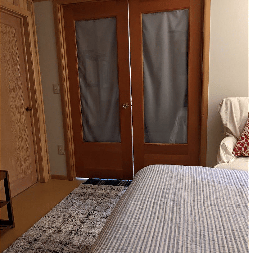 Double doors between bedroom, sitting / kitchenette, and TV room.