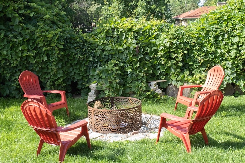 Firepit located next to covered deck