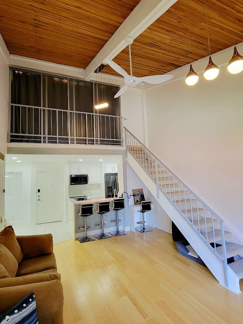 Living room / Kitchen / Upstairs Main room upstairs closed sliding panels and curtain