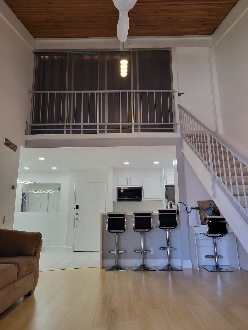 Living room / Kitchen / Upstairs Main room upstairs closed sliding panels and curtain