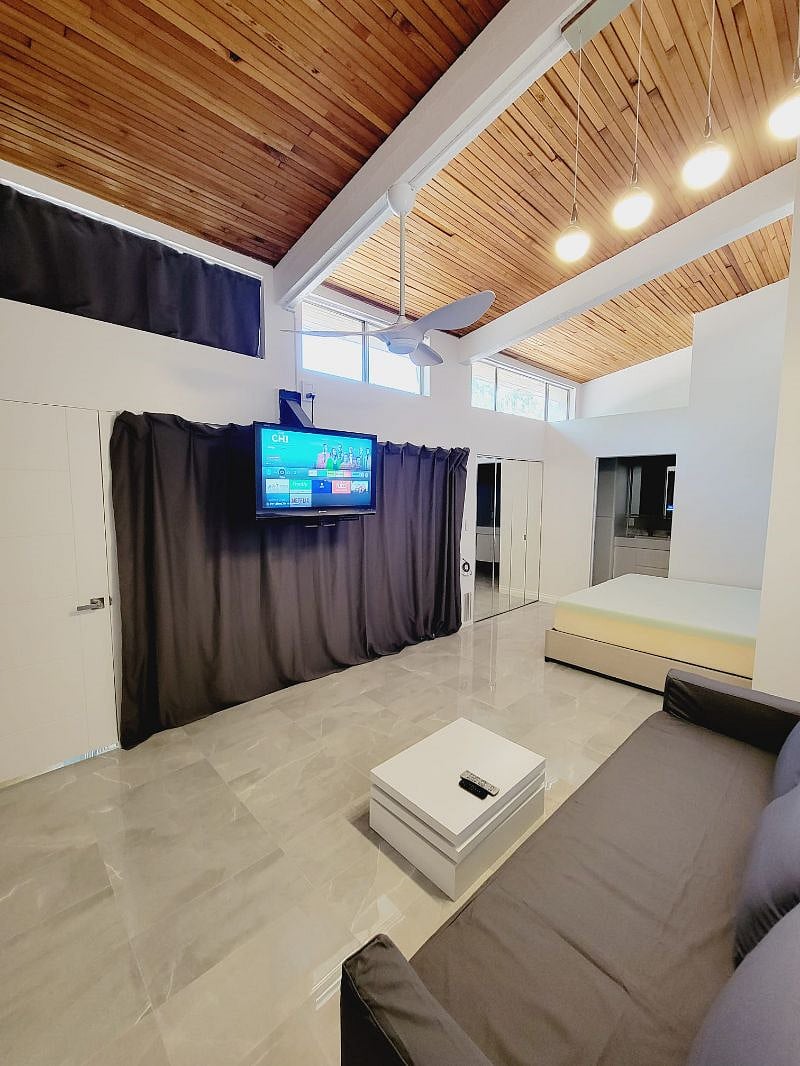 Main room upstairs closed door, sliding panels and curtain