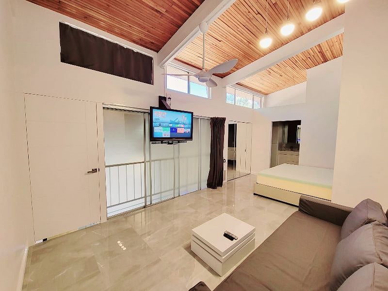 Main room upstairs closed door and sliding panels, open curtain