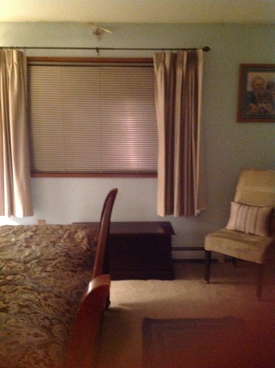 Side view of the Master Bedroom - Queen Size Bed, Storage Chest and Chair