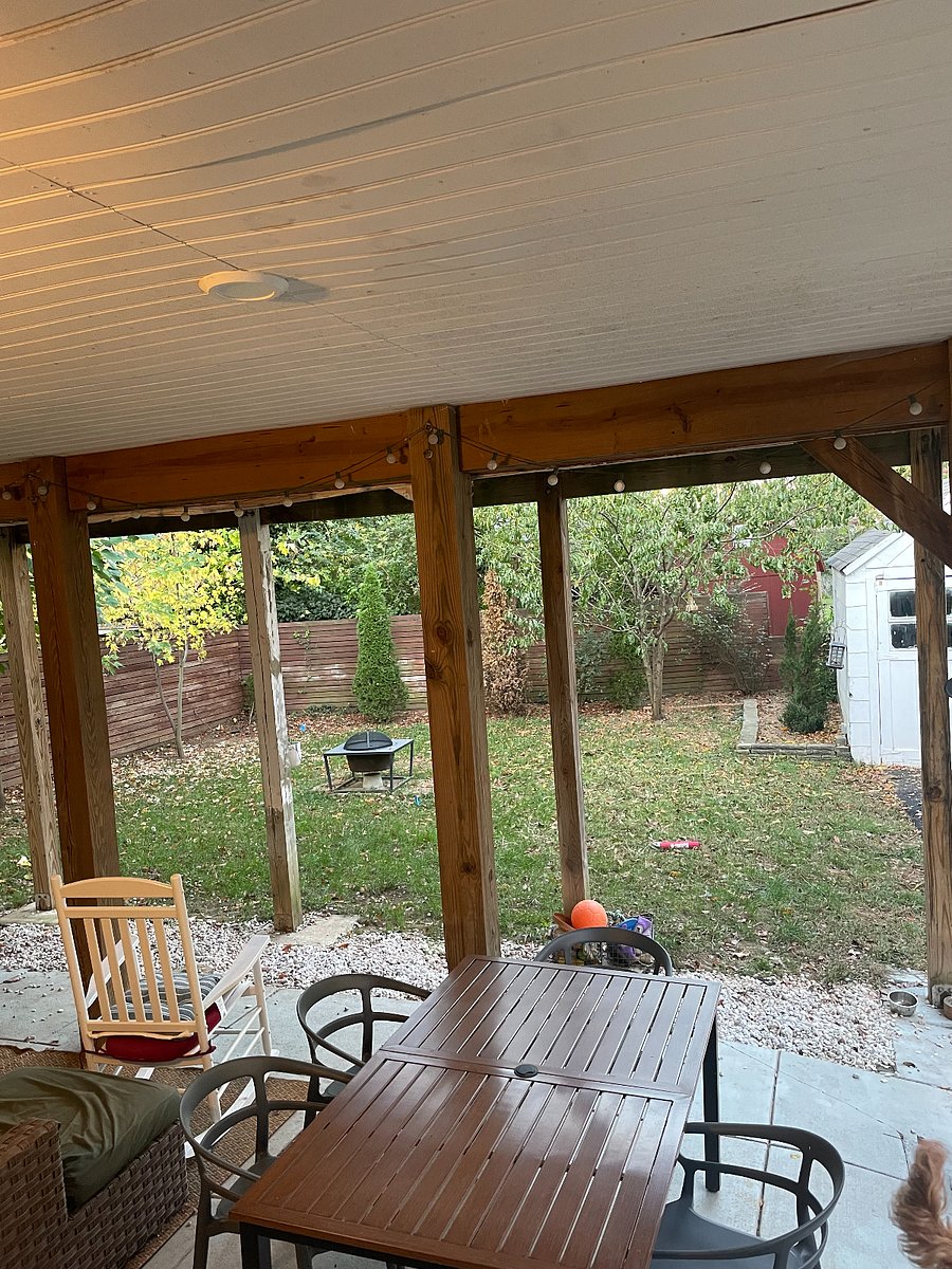 backyard with sectional couch, dining table