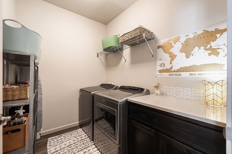 Full size w/d, folding area and storage shelves in laundry room. Laundry upstairs, next to primary bedroom and across hall from half bath.