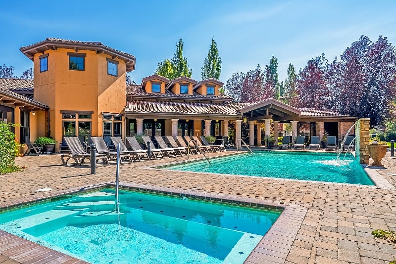Lounge chairs, tons of shady seating, grassy area and indoor clubhouse, gym and locker rooms.