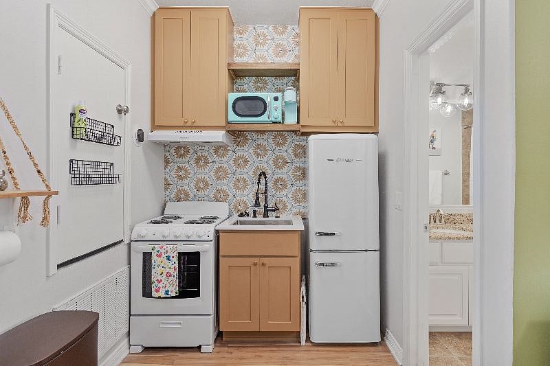 Quaint fully functional kitchen with retro appliances and all necessary amenities.  