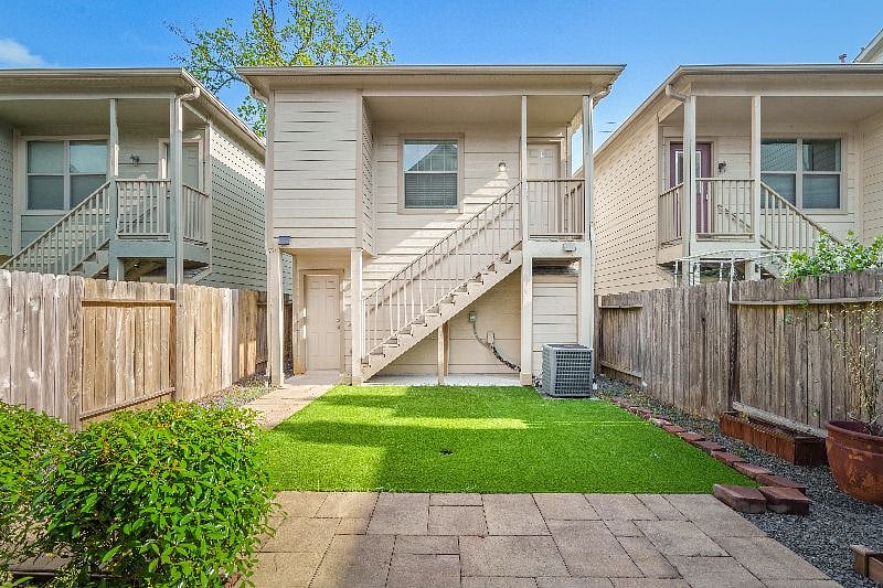 Private entrance to the garage apartment is on the left.  The apartment itself is upstairs.  Standalone building, no sharing of walls.  The main house is separated by the yard.