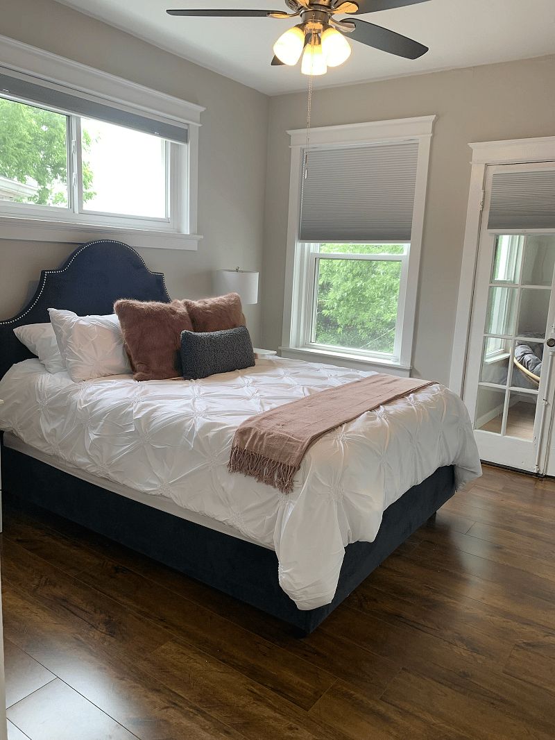 Queen bedroom with black out cellular shades.
