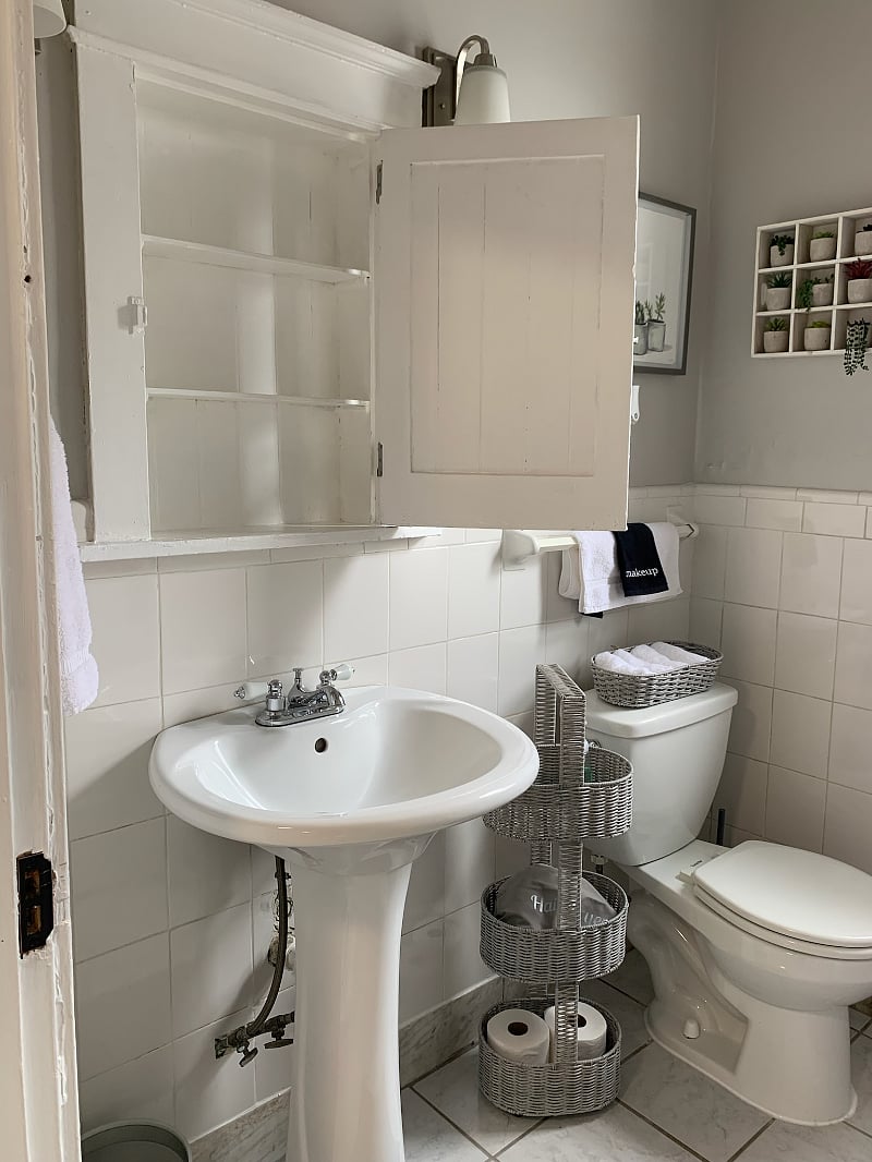 Storage behind mirror.